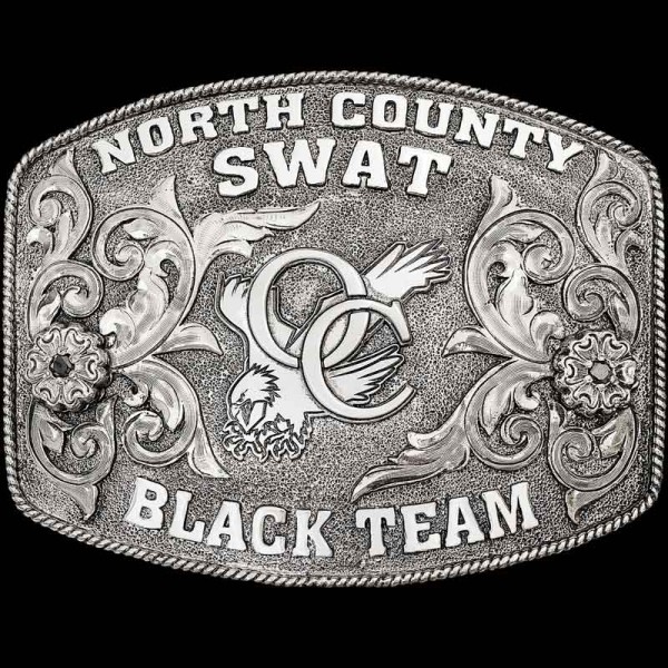 "Our Fullerton Belt Buckle is crafted on a German Silver base with a classic traditional rope edge, western-inspired scrolls, floral accents with cubic zirconia stones, and lettering. To complete this design of the buckle, we added our signature matt